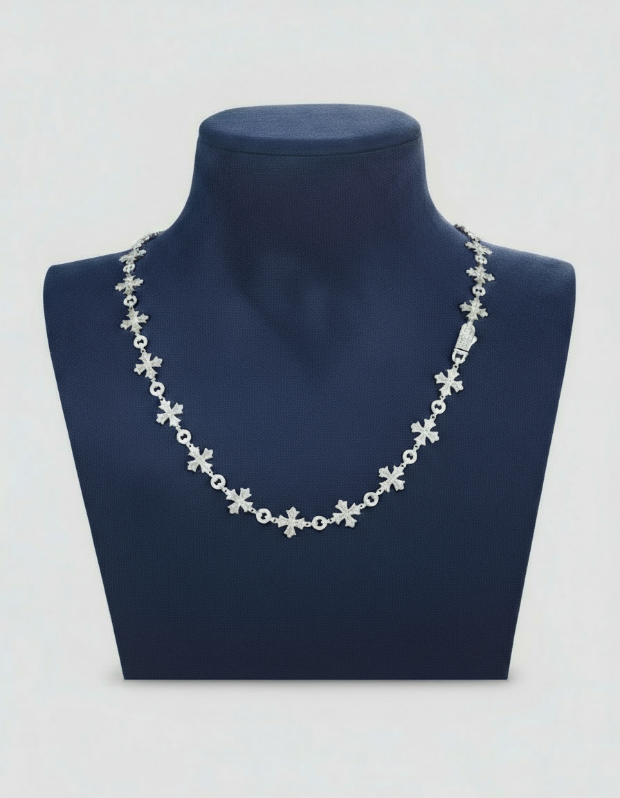 Silver necklace on a blue mannequin bust with a clear background